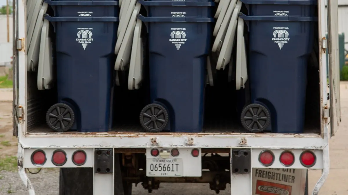 New Kansas City trash carts on a truck.