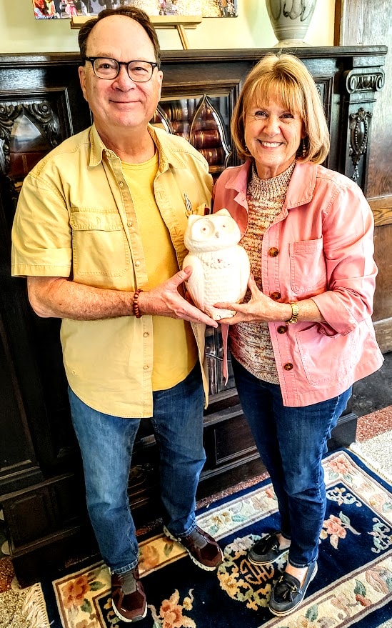 Steve and Allison Paddock, Elmwood Cemetery board members, hold a ceramic owl that contains cremains of an unknown person.
