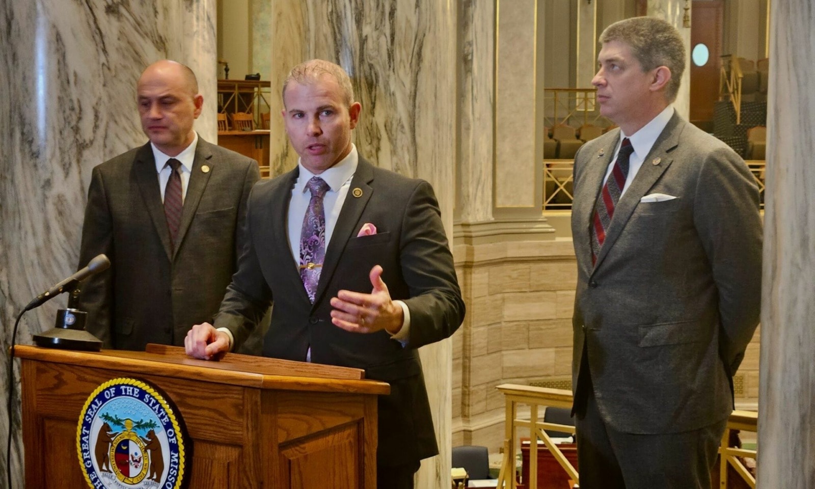 Sen. Rick Brattin, center, makes a point on April 2 during the Freedom Caucus weekly news conference also attended by Sens. Denny Hoskins, left, and Bill Eigel.