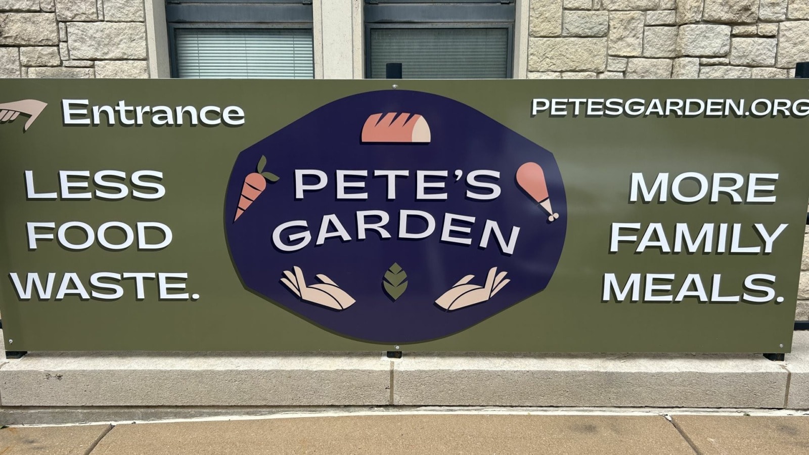 A banner for Pete’s Garden hangs outside of the Grace & Holy Trinity campus.