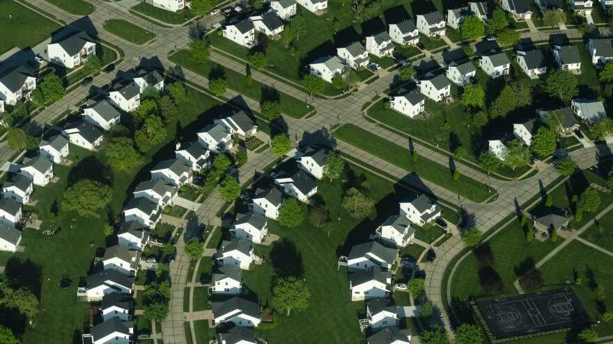 Homes with lawns are seen during a LightHawk flight on Wednesday, April 24, 2024, in O'Fallon, Missouri outside of St. Louis.