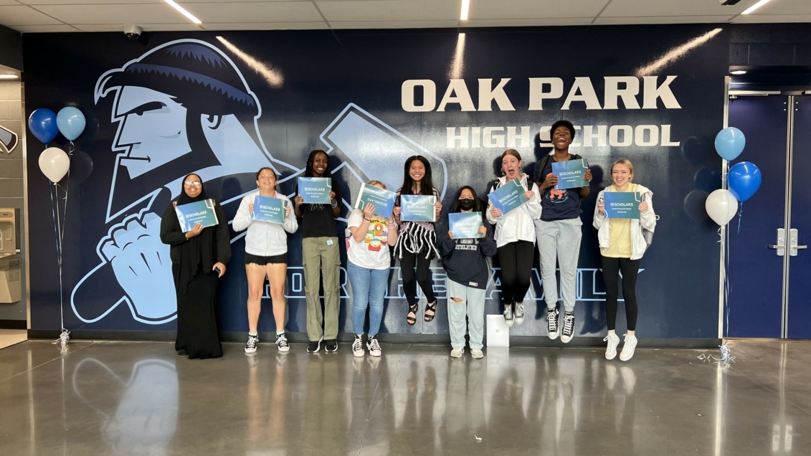 Juniors from Oak Park High School pose for a photo after learning they were selected to join the KC Scholars program on May 1, 2023.