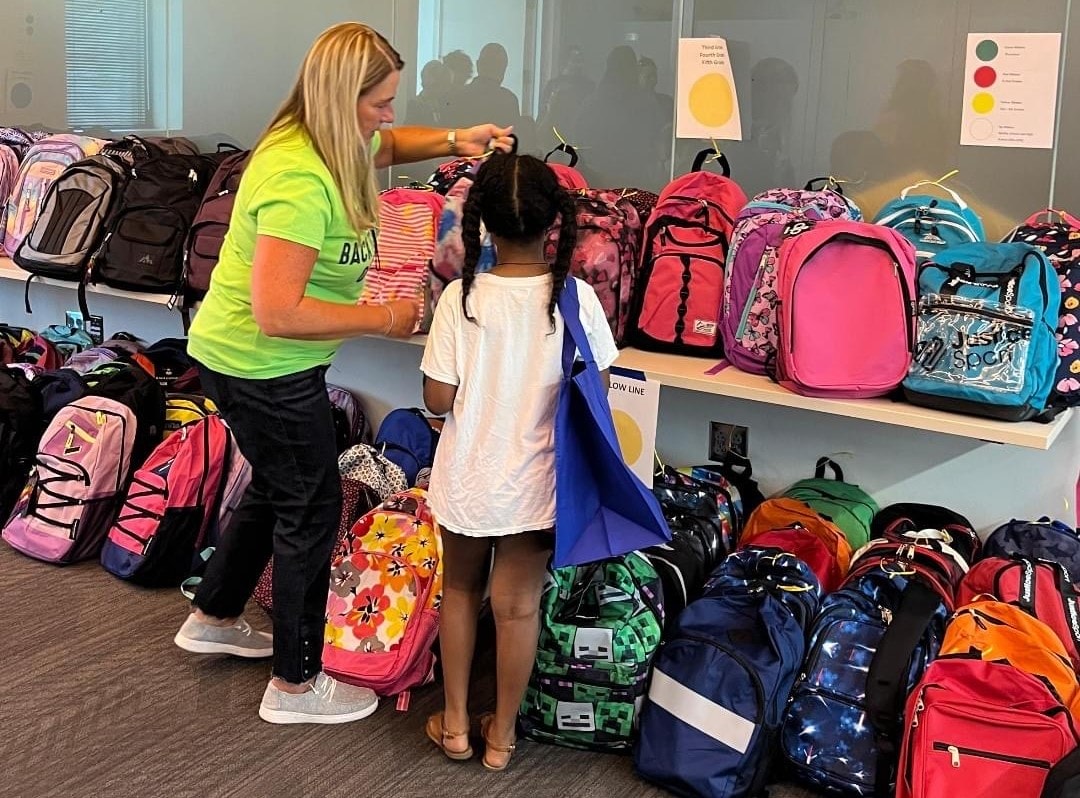 A student selects a backpack during last year's Olathe Public Schools Foundation school supply drive.